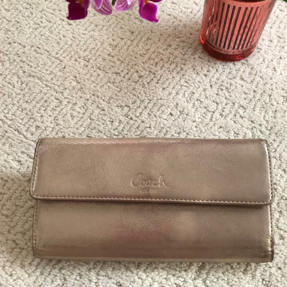 Coach gold leather wallet.